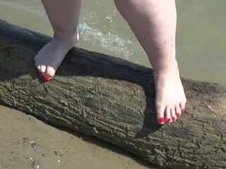 'Fat nude gams with crimson pedicure walk along the bank of the sea, fetish.'