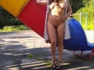 'magnificent, youthfull exhibitionist damsel flashes off her magnificent assets on the Playground'