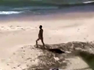 A covert webcam Films A couple On Beach