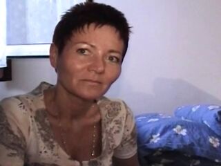 Short haired German chick pleasing her furry pussy with a fake penis