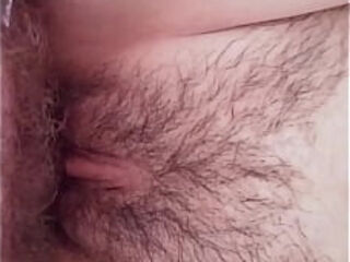 Furry cougar vulva poked close-up