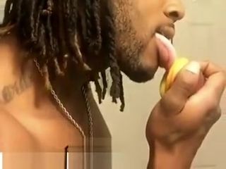 Boy tongue tearing up a peach